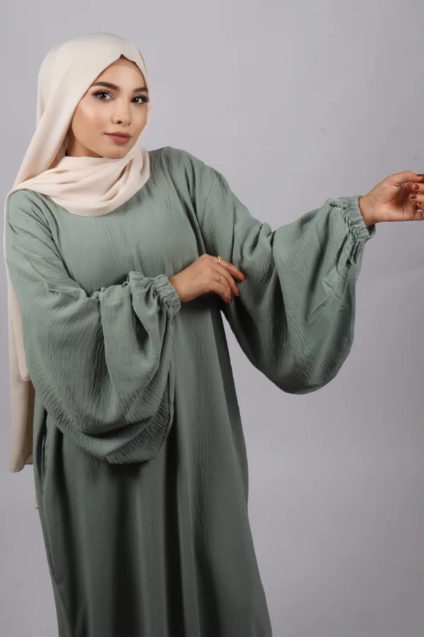 3CACFE30-401F-4739-8B83-0B5C29AC0DCF.jpeg Elyssa Premium Jazz Abaya Set with complimentary Khimar - Pastel Green - Image 1